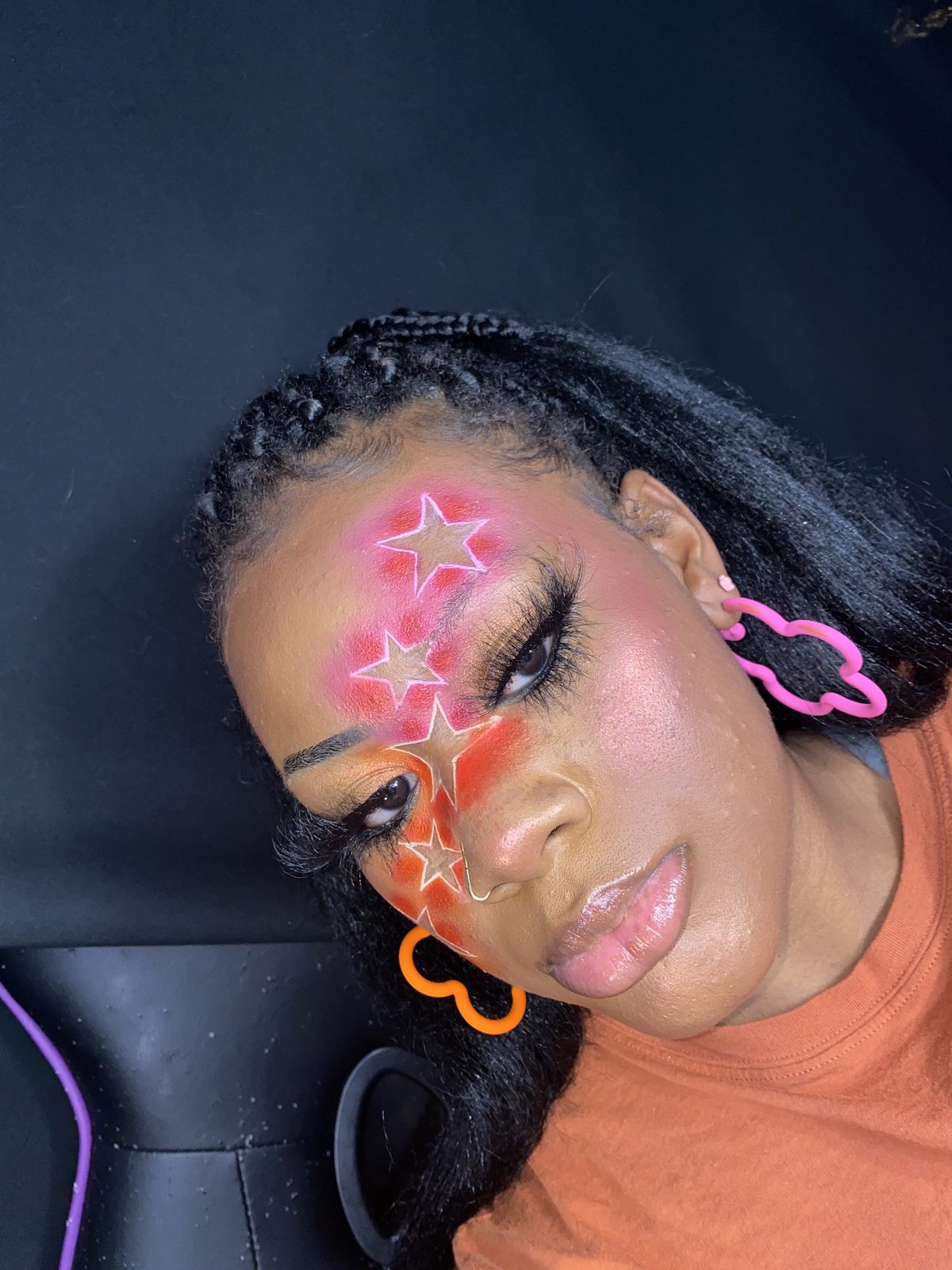 Red star face paint across the forehead