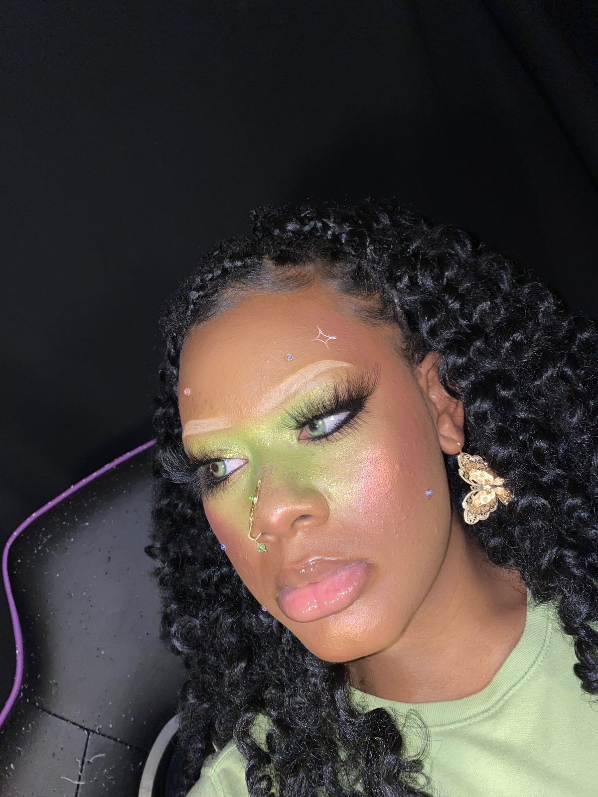 Lime green glitter eye look with face gems